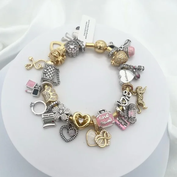 Linx Yellow Gold Bracelet with Gold Silver and Pink Nurse Girlfriend Charms